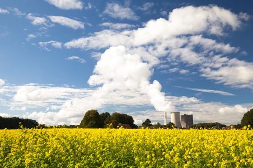 The clouds over a rapeseed field in the countryside