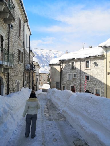 A vertical back view of a woman in Sant'eufemia a Maiella in Pescara, Abruzzo, Italy
