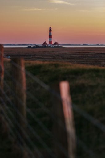 A vertical shot of Westerheversand lighthouse, Leuchtturm Westerheversand. Germany.