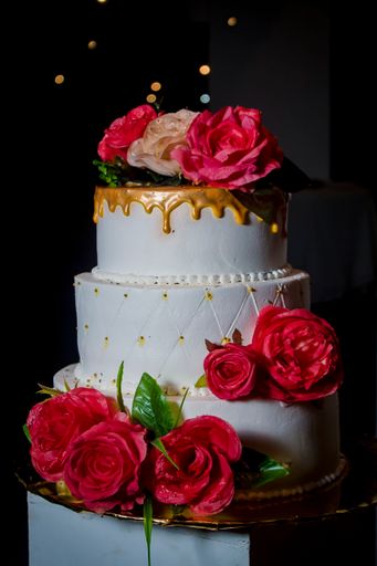 A vertical shot of a 3-tier wedding cake