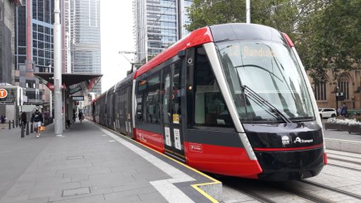 A closeup shot of the autonomous rail rapid bus tram passing through the city of Sydney, Australia