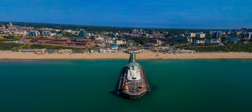 A beautiful view of the Bournemouth Pier under the blue sky