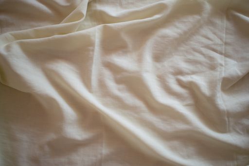 A high angle shot of a wavy white cotton surface