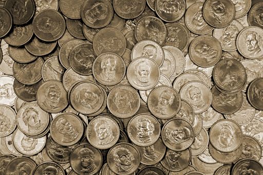 A closeup of a pile of coins on a table