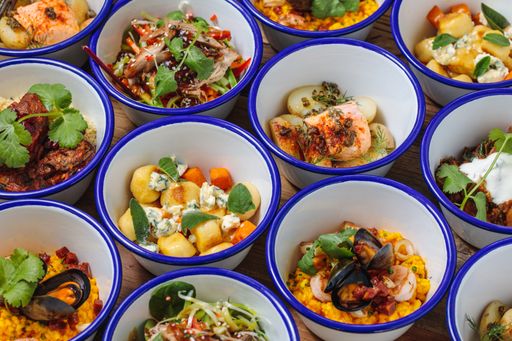A high  angle shot of different dishes near each other on a wooden table