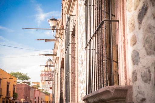 A closeup shot of wrought Iron window grill Iron window in  San Miguel Allende street view