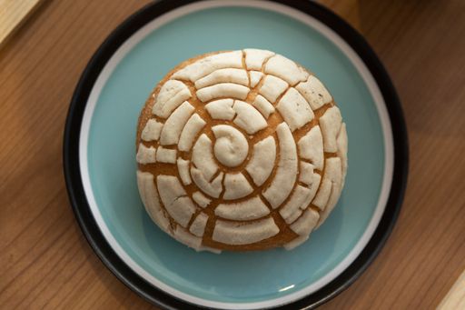 A top view of Mexican sweet bread on a plate - perfect for food blog and menu