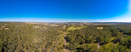 A panoramic shot of roads surrounded by dense green trees in Emmaville, NSW, Australia