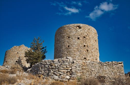 A low angle shot of an old castle under the beautiful sky in Symi, Greece