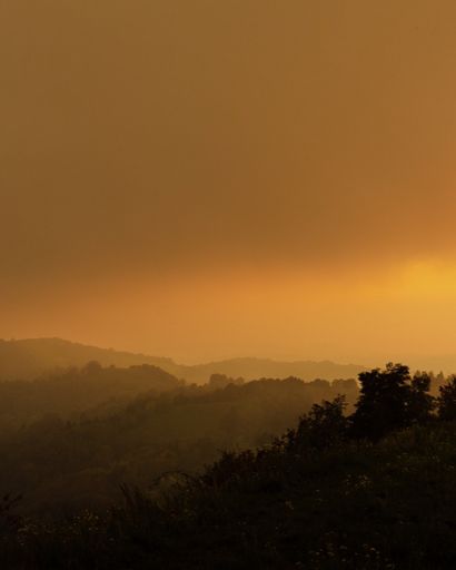 A vertical shot of a scenic sunset over the town