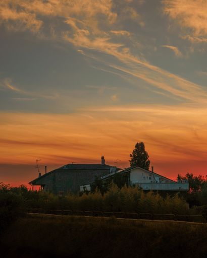 A vertical shot of a scenic sunset over the town