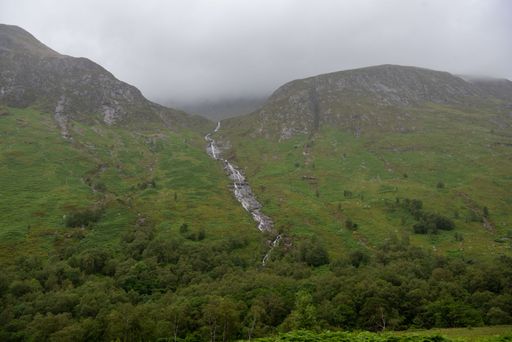 A mesmerizing view of a beautiful mountainous landscape with a creek