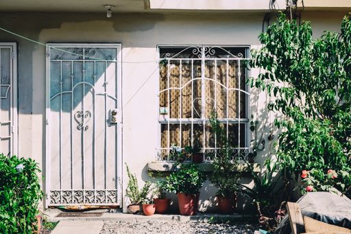 A closeup shot of window and door grills on the house