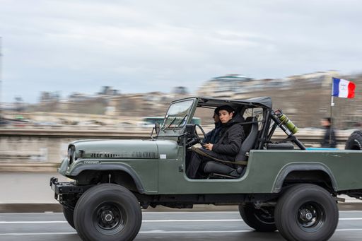 An old classic green off road car in the city, Jeep CJ8