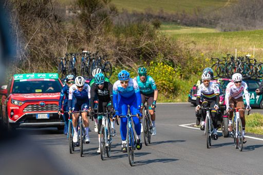 A group of cyclists traveling an uphill road on the Tirreno-Adriatico road cycling stage race