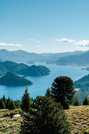 A vertical shot of a beautiful lake near the mountains