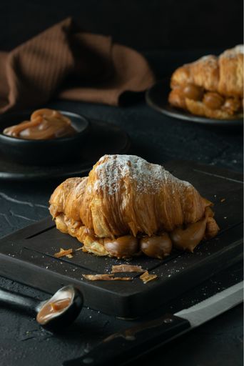 A vertical closeup shot of some croissants on a plate