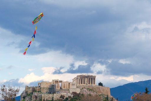 kites over the beautiful blue sky of the city of Athens. Hellas