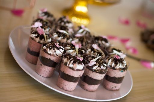 A closeup shot of cute chocolate cupcakes with pink cream