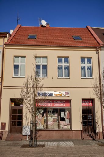 A vertical shot of a front of a small Bielbaw Home store in the city center