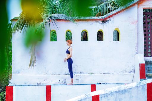 A young Caucasian yogini in an ancient Hindu temple in Mysore, India