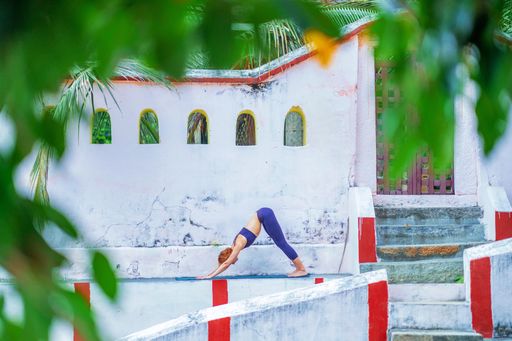 A young Caucasian yogini in an ancient Hindu temple in Mysore, India
