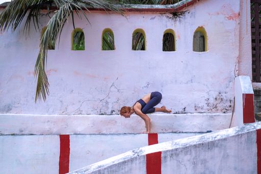 A young Caucasian yogini in an ancient Hindu temple in Mysore, India