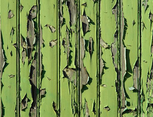 A closeup of a green wall with peeling paint. Great for backgrounds
