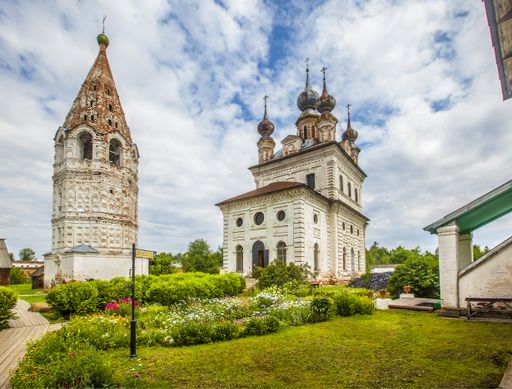 A horizontal shot of an Orthodox Christian temple and a tower in Yuryev-Polsky, Russia