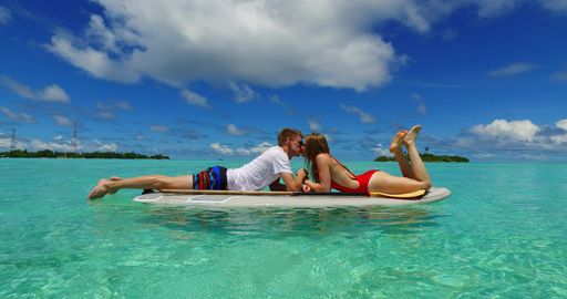 A young couple enjoying their vacation at the beautiful island of Rasdhoo in the Maldives