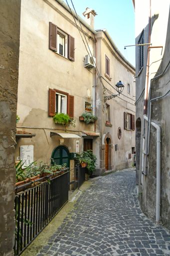 A closeup of a narrow street among the old stone houses of Ripi, a medieval town in Italy
