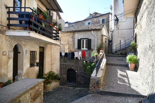 A closeup of a narrow street among the old stone houses of Ripi, a medieval town in Italy