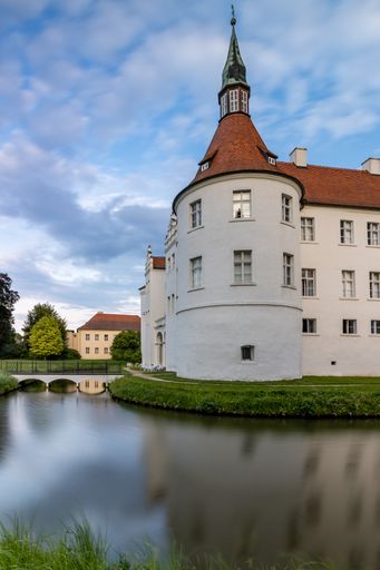 A vertical shot of Drehna Castle in Brandenburg, Germany on cloudy sky background