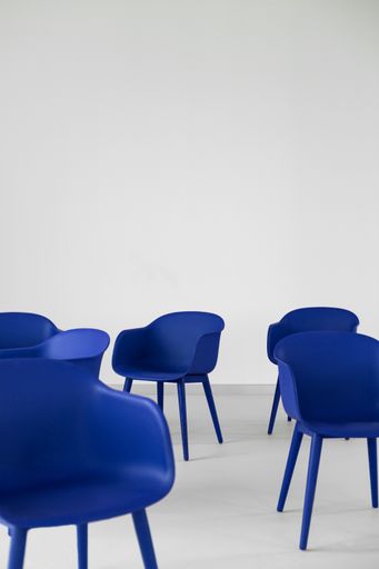 A vertical shot of the modern electric blue chairs on a white background