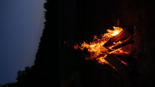 A close-up shot of a big bonfire at night
