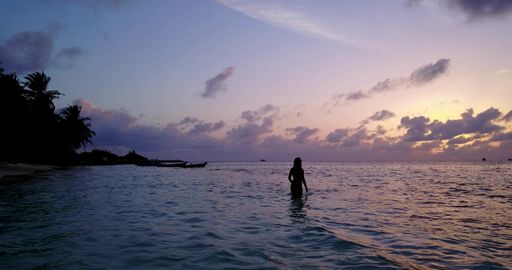 A Caucasian woman enjoying her vacation in the water of the ocean, Maldives