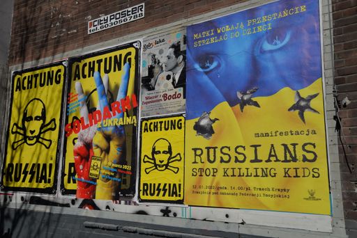 A view of support and anti-Putin signs and banners on the wall in the war