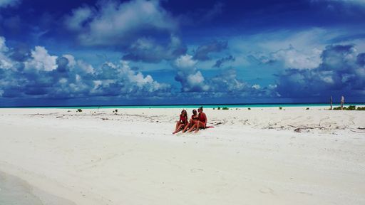 A group of women on the beach of Fulhadhoo Island, The Maldives