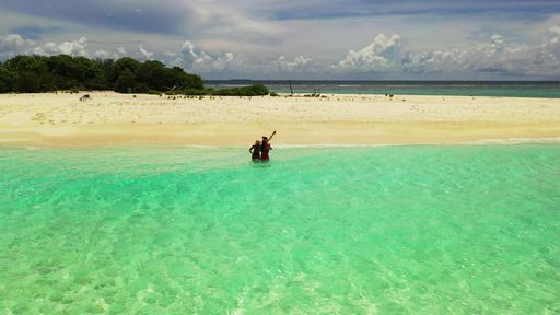 The Caucasian women from Russia on the beach in Fulhadhoo Island, the Maldives
