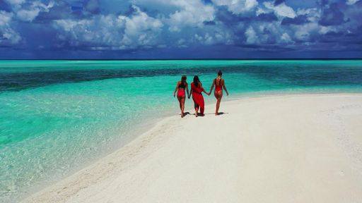The Caucasian women from Russia on the beach in Fulhadhoo Island, the Maldives