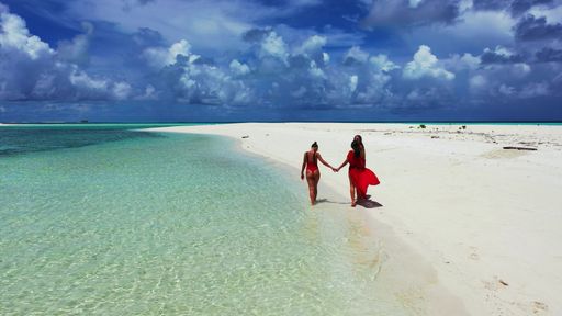 The Caucasian women from Russia on the beach in Fulhadhoo Island, the Maldives