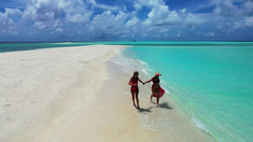 The Caucasian women from Russia relaxing in Fulhadhoo Island, the Maldives