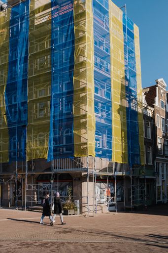 A shot of a house in Amsterdam, decorated with Ukrainian flag colors.