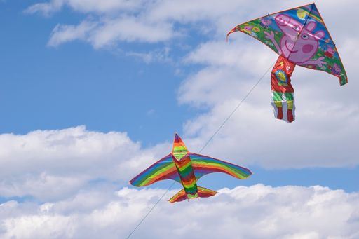 Colorful kites flying over blue sky. Athens , Greece