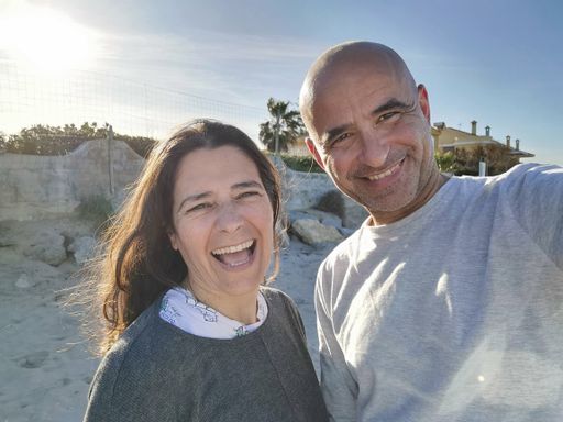 A close-up shot of a middle-aged Spanish couple enjoying themselves together laughing