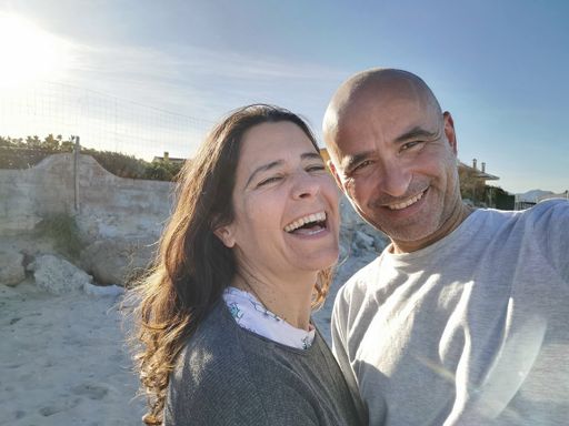 A close-up shot of a middle-aged Spanish couple enjoying themselves together laughing