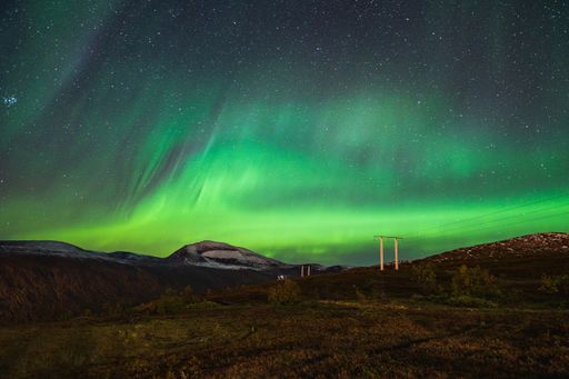 A beautiful scenery of Aurora borealis in the night sky of Tromso Lofoten Islands, Norway