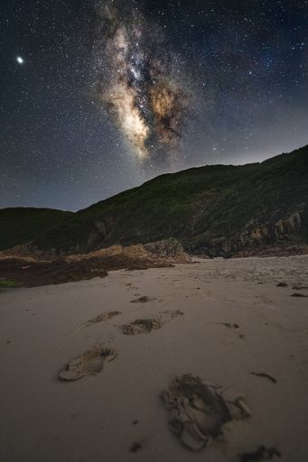A beautiful scenery of Milky Way Galaxy in the night sky over a landscape in Hong Kong