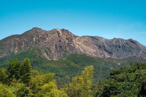 A beautiful scenery of a mountainous landscape with high rocky mountains under a cloudy sky