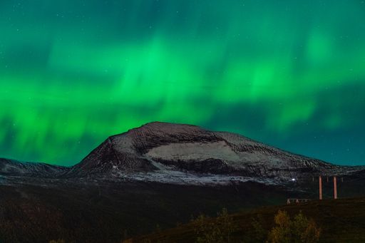 A mesmerizing shot of Aurora borealis in the night sky captured in Norway